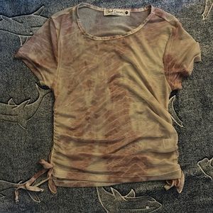 See through snake skin print pink cream colored shirt ruching on both sides.